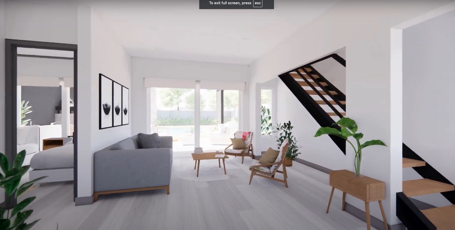 Casa TRES: Living con sofá gris, sillones y escalera, con ventanal al jardín